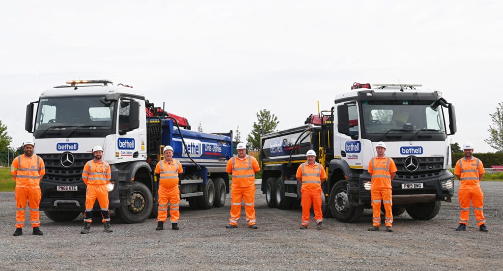 Line-up of Bethell civil operatives in front of plant