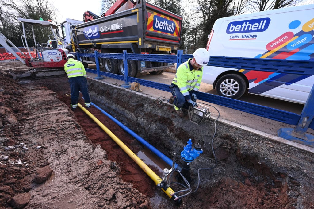 Two Bethell operatives installing water and gas connections