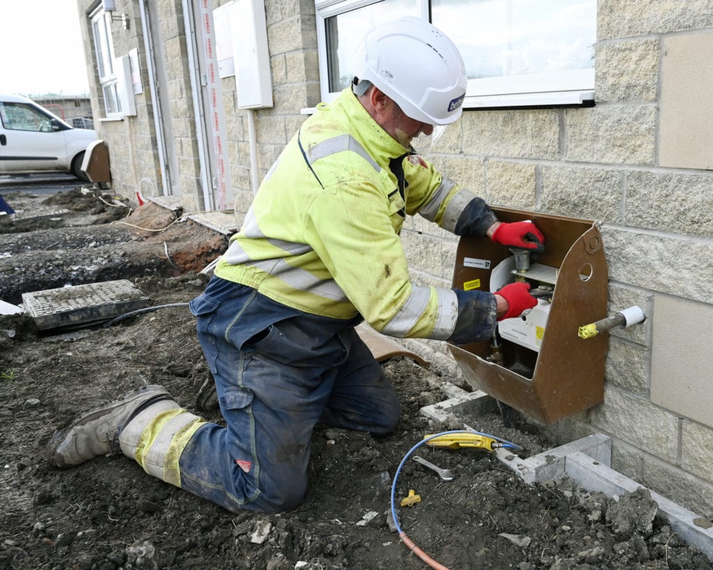 Bethell engineer installing a gas connection at a home