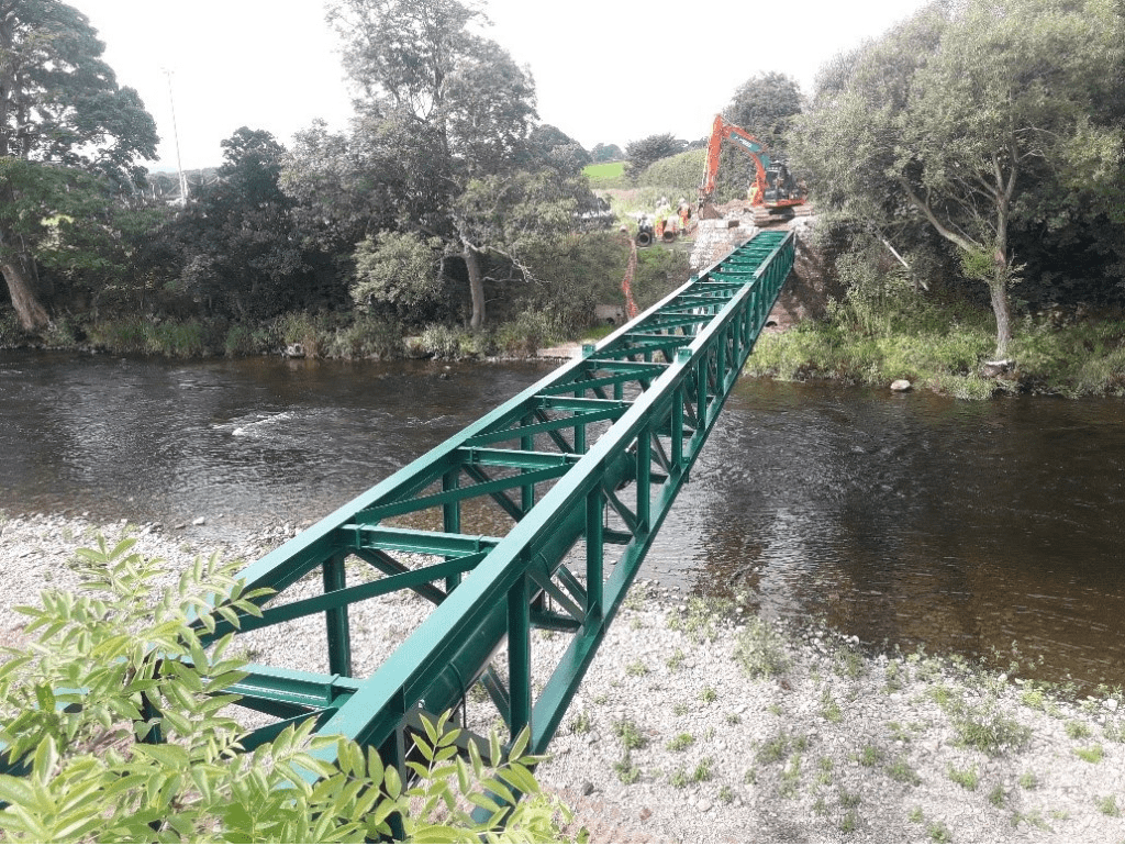 Support structure being installed over a river