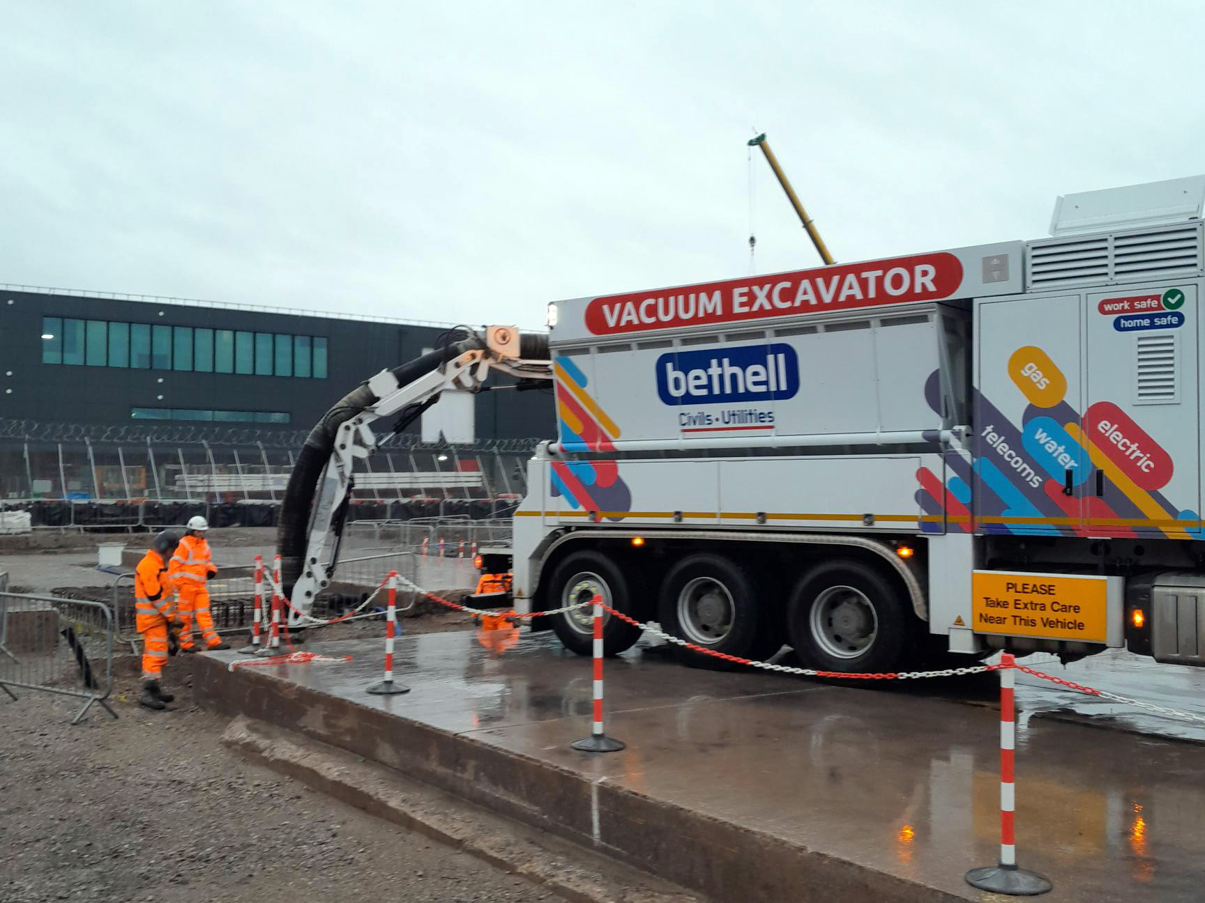 Vacuum excavator digging a trench in an airfield