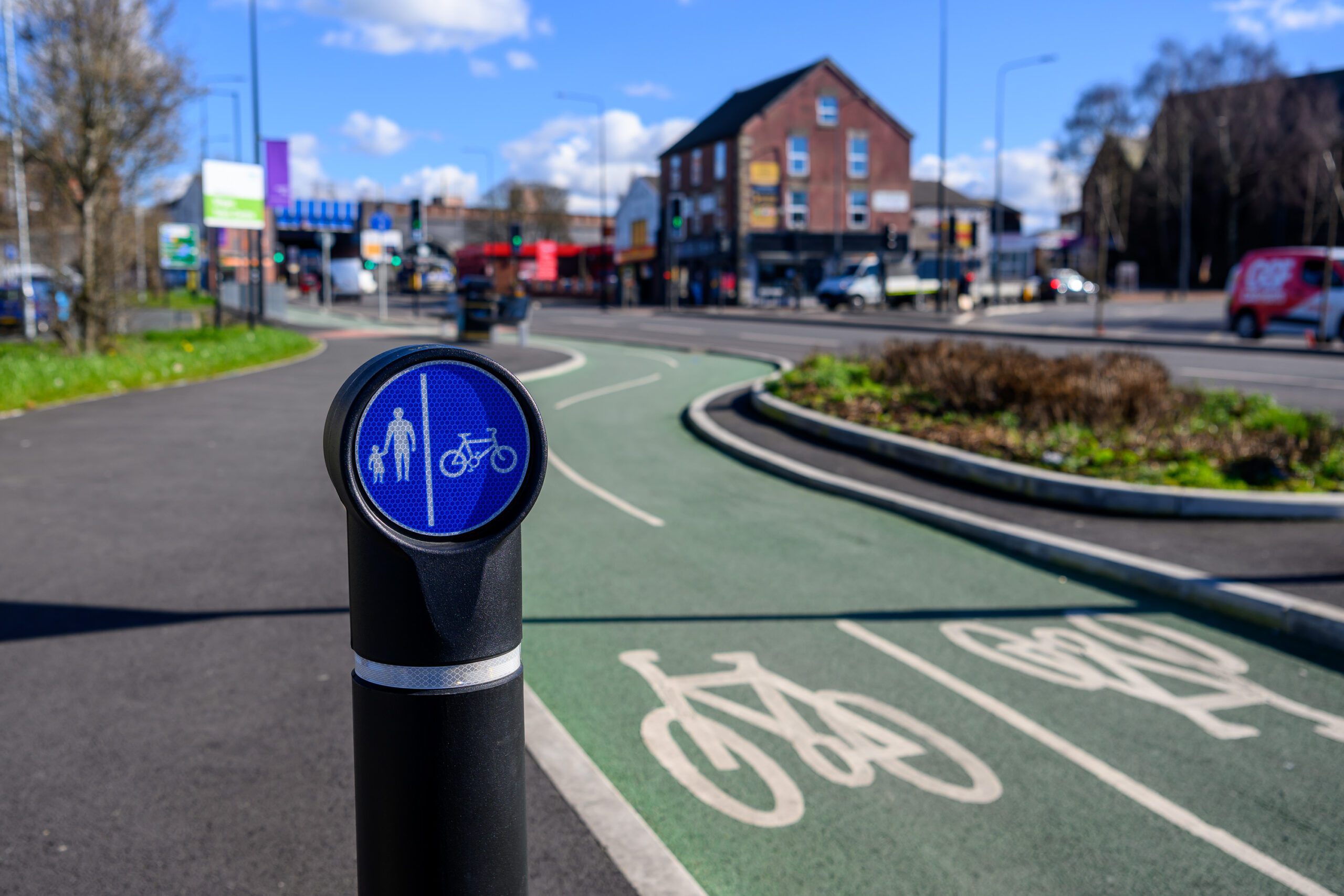 A bollard in front of a cycle lane in Wigan
