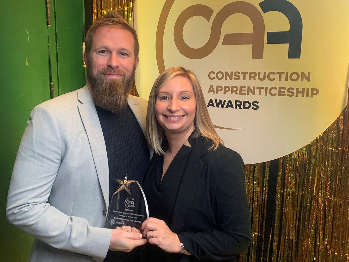 Two people celebrating award win at awards ceremony