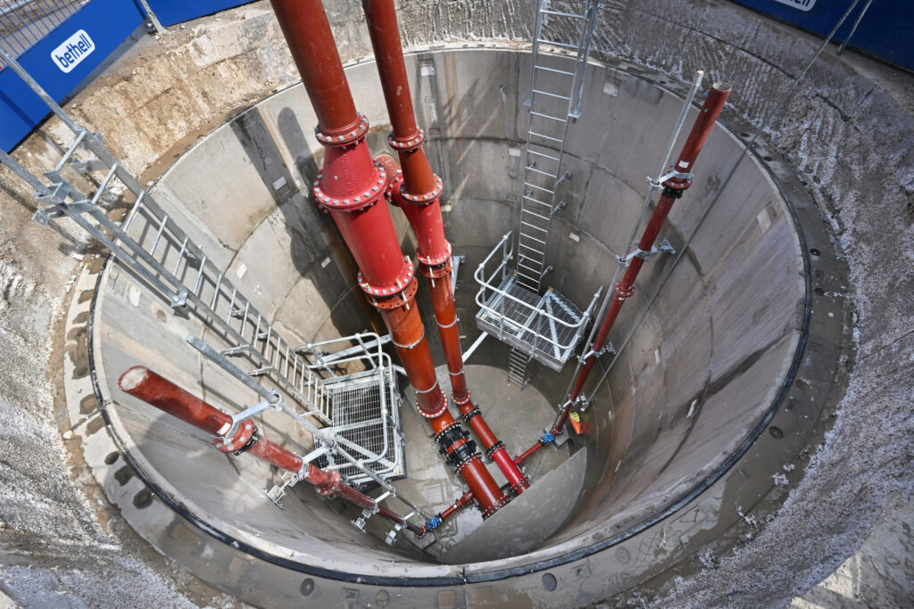 Red pipework in a large shaft